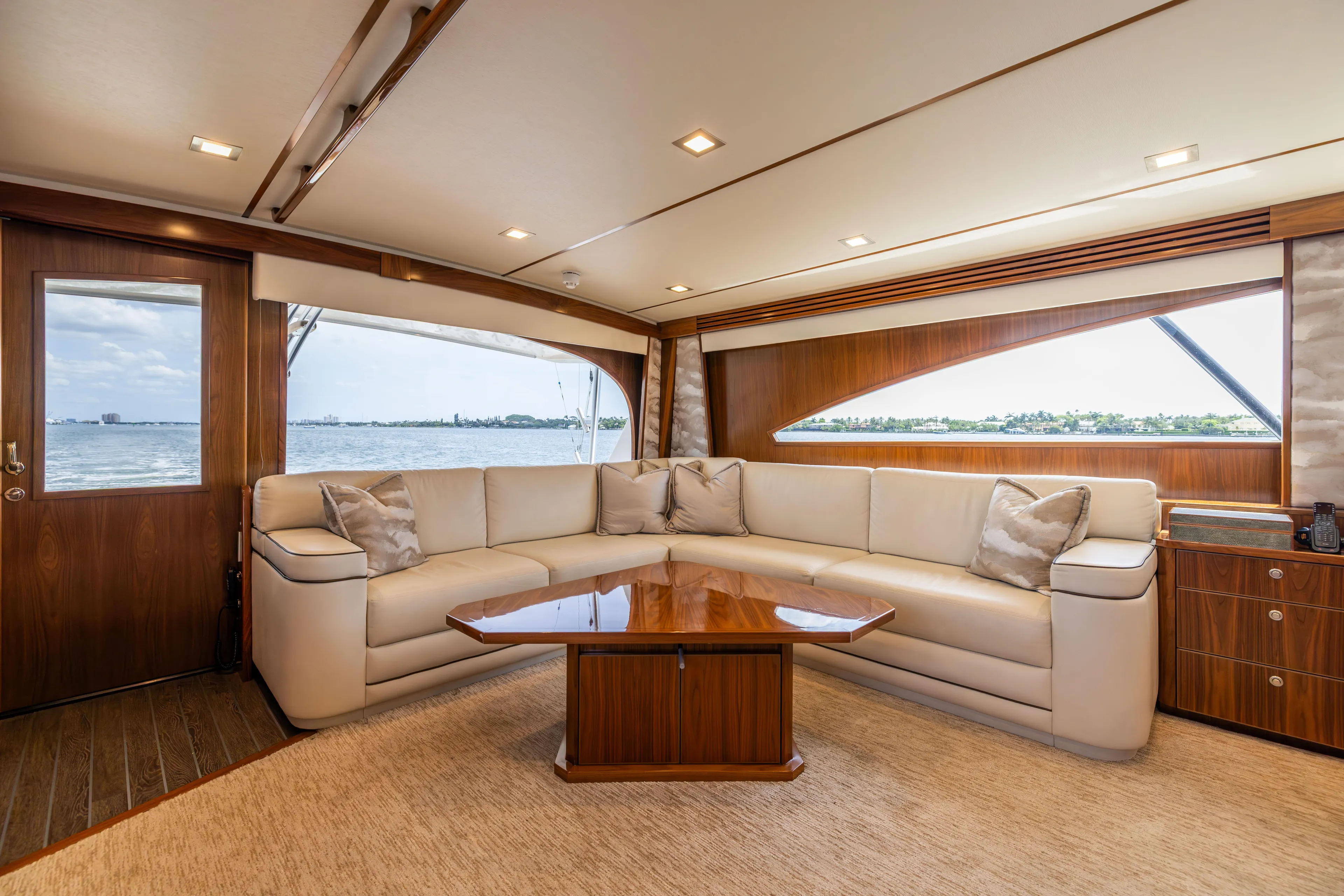 2020 Viking 80 Yacht Photos Pics Luxurious interior of 2020 Viking 80 Convertible yacht with elegant seating and panoramic windows.