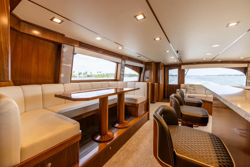 2020 Viking 80 Yacht Photos Pics Luxurious interior of 2020 Viking 80 Convertible yacht with elegant seating and ocean view.