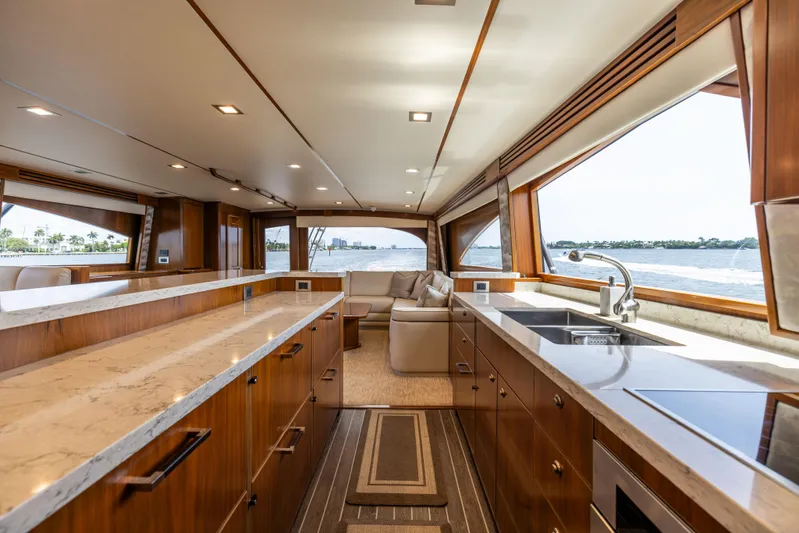 2020 Viking 80 Yacht Photos Pics Luxurious interior of 2020 Viking 80 Convertible yacht with modern kitchen and scenic views.