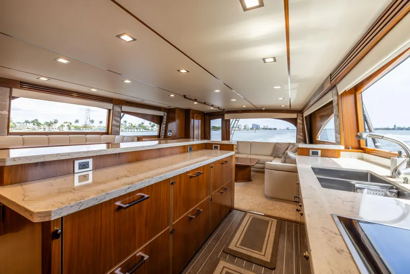 2020 Viking 80 Yacht Photos Pics Luxurious interior of 2020 Viking 80 Convertible yacht with modern kitchen and seating area.