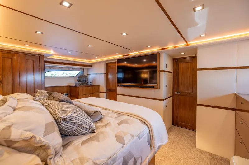 2020 Viking 80 Yacht Photos Pics Luxurious bedroom interior of 2020 Viking 80 Convertible yacht with modern amenities.