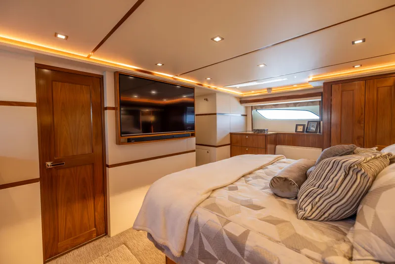 2020 Viking 80 Yacht Photos Pics Luxurious bedroom interior of 2020 Viking 80 Convertible yacht with modern amenities.