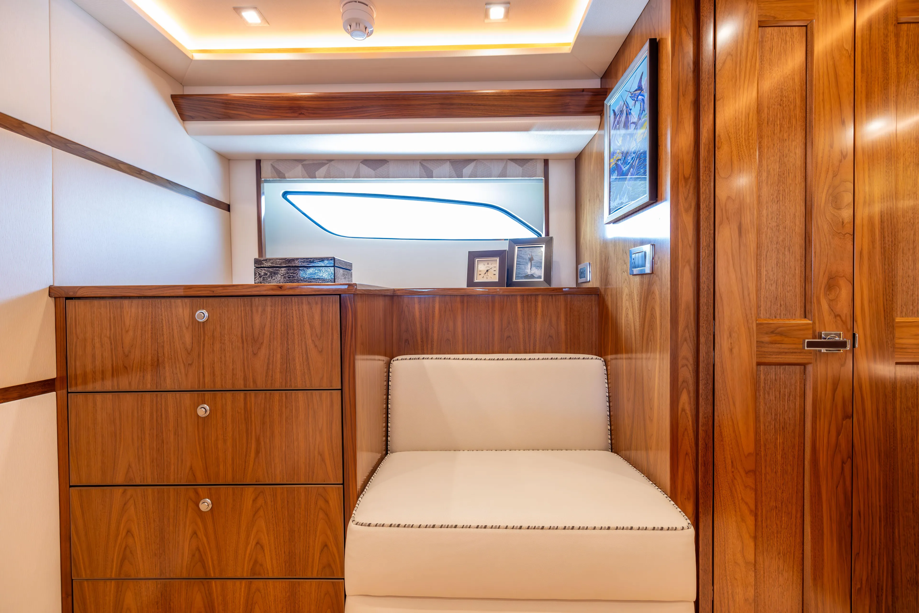 2020 Viking 80 Yacht Photos Pics Luxurious interior of 2020 Viking 80 Convertible yacht with wood finishes and elegant seating.