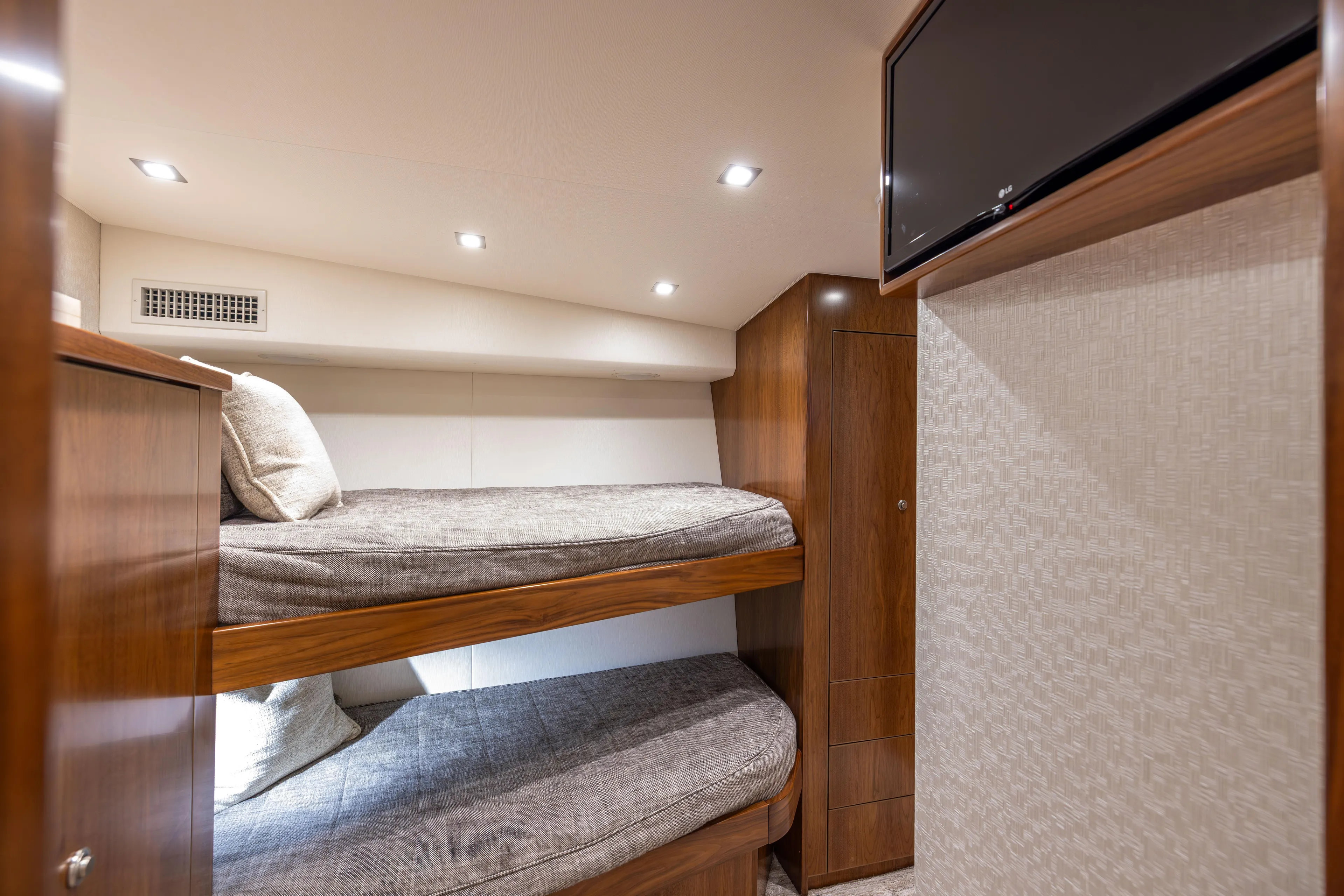 2020 Viking 80 Yacht Photos Pics Interior of 2020 Viking 80 Convertible yacht with cozy bunk beds and modern lighting.