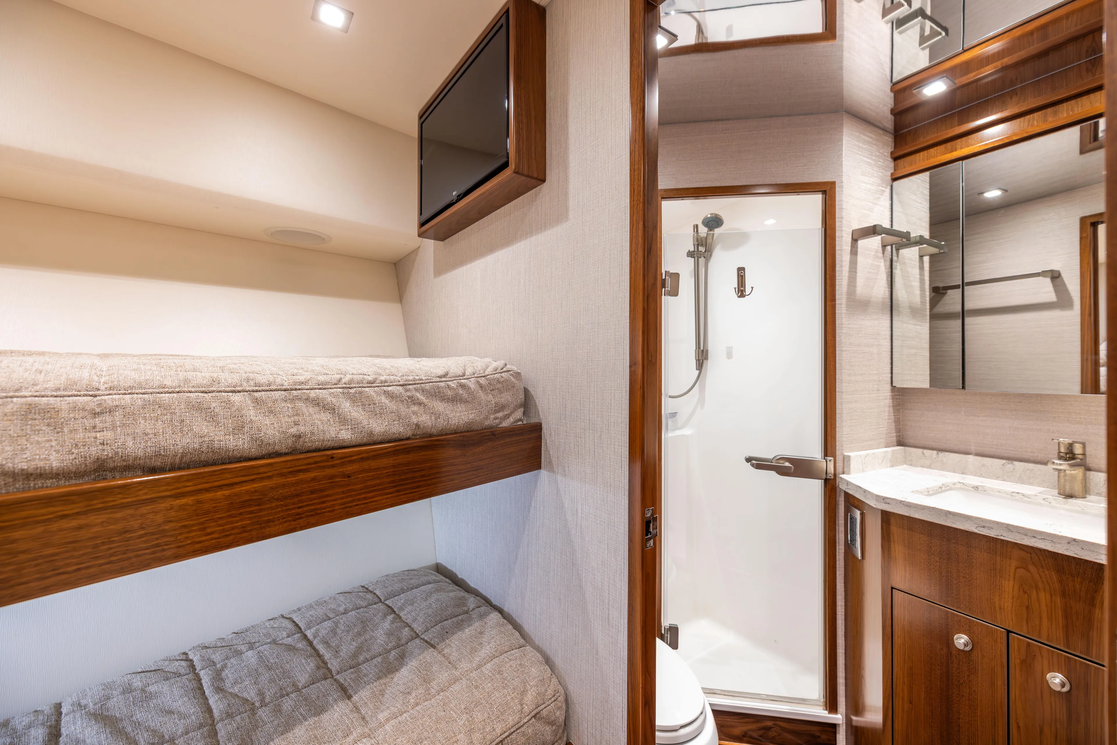 2020 Viking 80 Yacht Photos Pics 2020 Viking 80 Convertible yacht interior with bunk beds and bathroom.