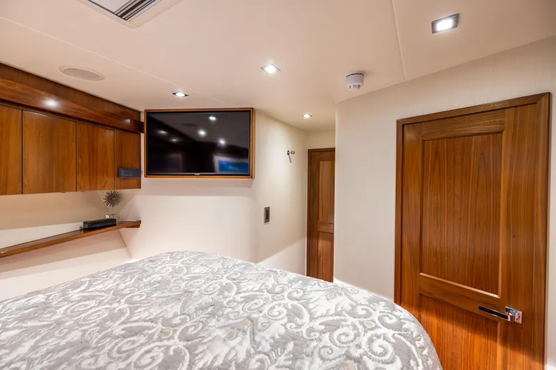 2020 Viking 80 Yacht Photos Pics Luxurious cabin interior of 2020 Viking 80 Convertible yacht with wood accents and modern amenities.