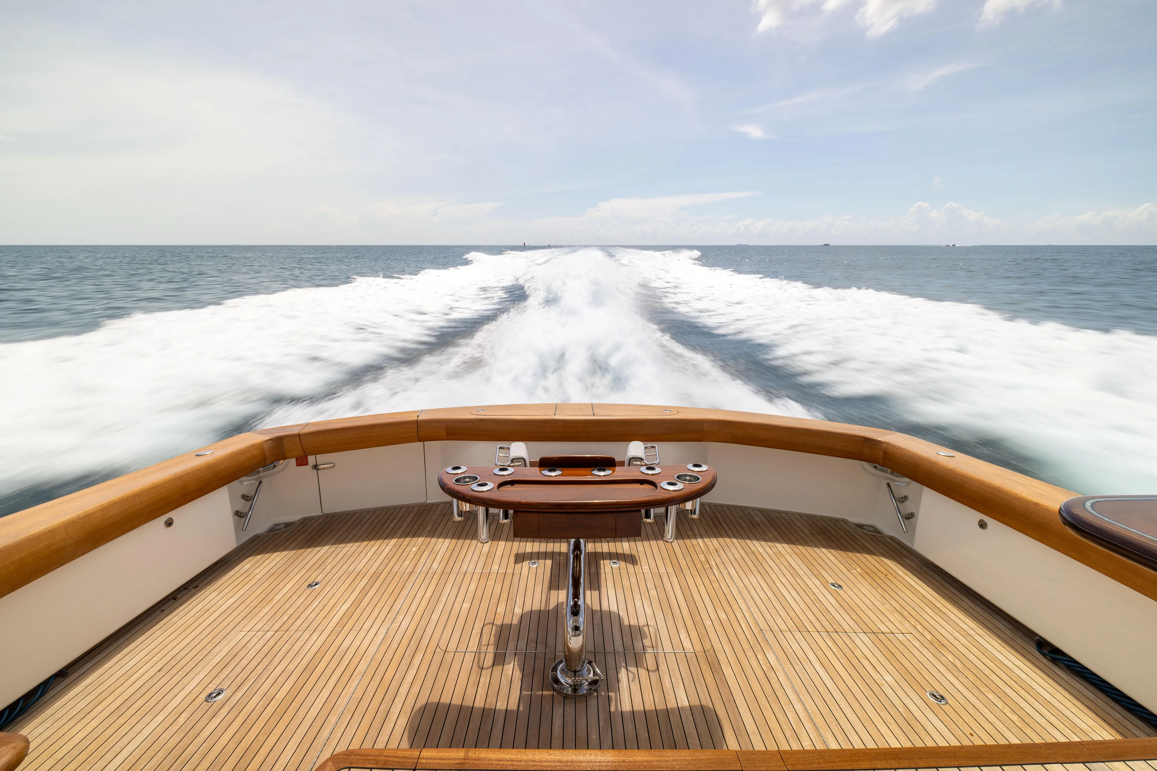 2020 Viking 80 Yacht Photos Pics 2020 Viking 80 Convertible yacht cruising on open sea, view from deck.