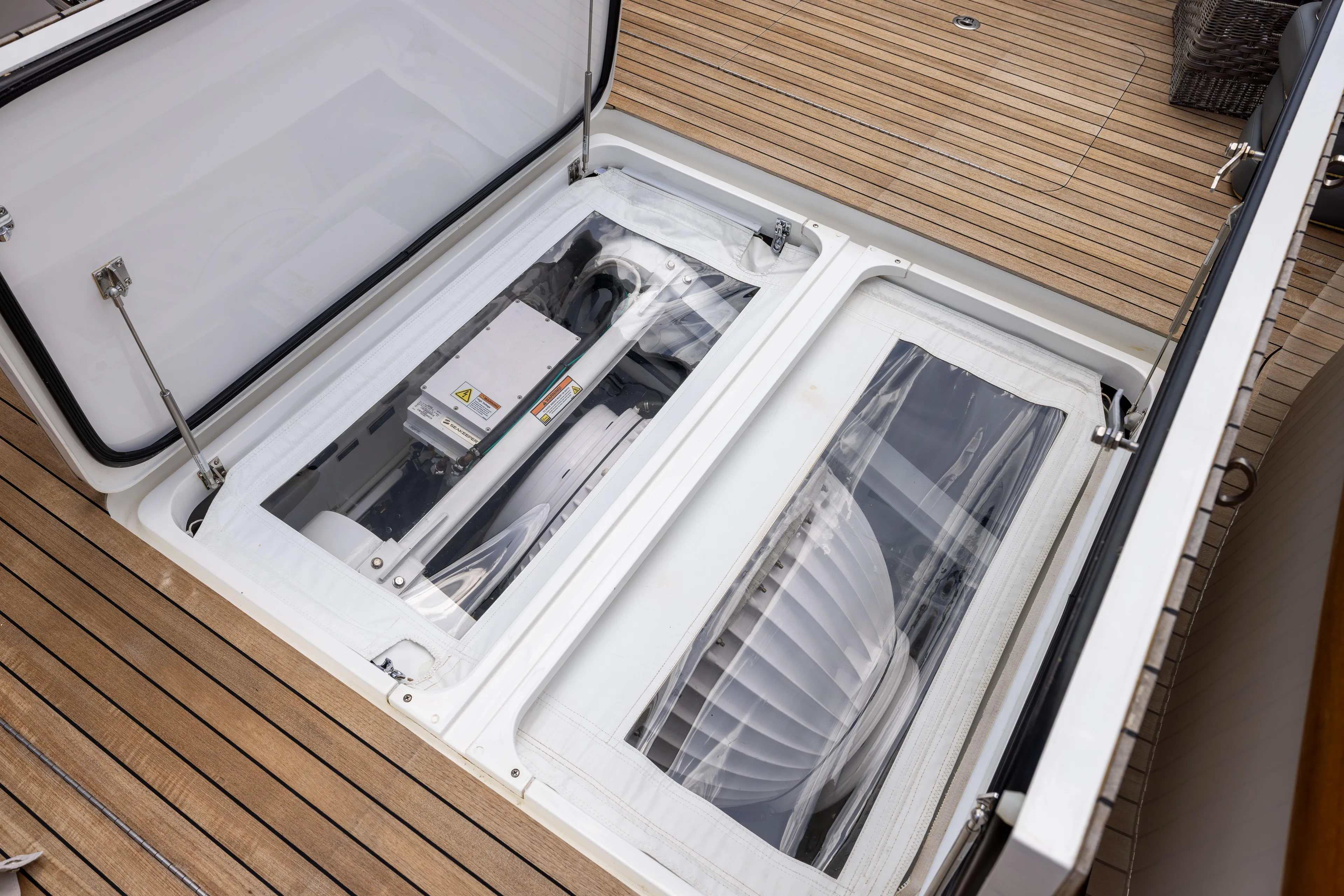 2020 Viking 80 Yacht Photos Pics 2020 Viking 80 Convertible yacht engine compartment with open hatch on teak deck.
