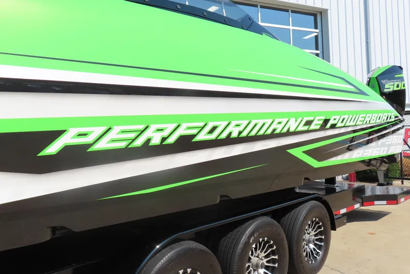  Yacht Photos Pics 2025 Performance Powerboat p360 with vibrant green and black design on trailer.