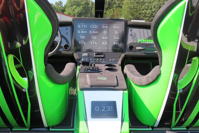  Yacht Photos Pics 2025 Performance Powerboat p360 cockpit with vibrant green seats and advanced digital dashboard.