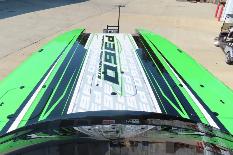  Yacht Photos Pics 2025 Performance Powerboat P360 with vibrant green and black design on deck.