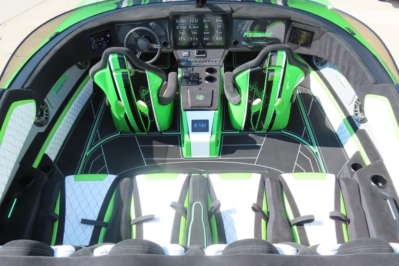  Yacht Photos Pics 2025 Performance Powerboat p360 interior with green and black sporty design and advanced dashboard.