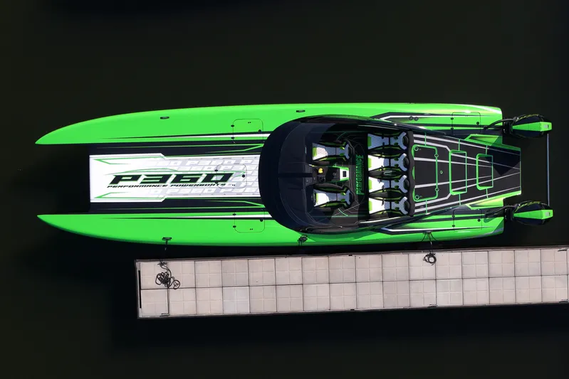  Yacht Photos Pics Aerial view of 2025 Performance Powerboat p360 docked, featuring vibrant green and black design.