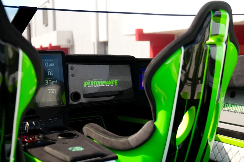  Yacht Photos Pics Interior of 2025 Performance Powerboats P360, featuring modern dashboard and vibrant green seating.