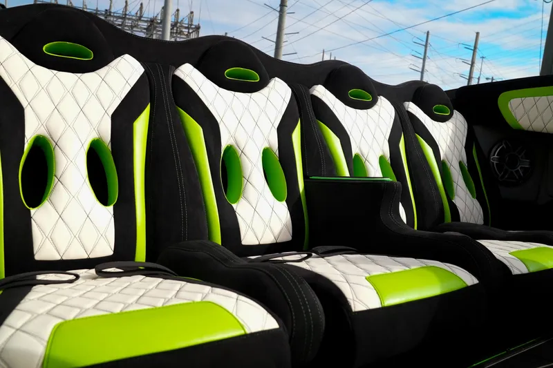  Yacht Photos Pics Luxurious interior of 2025 Performance Powerboats P360 with green and white seating.