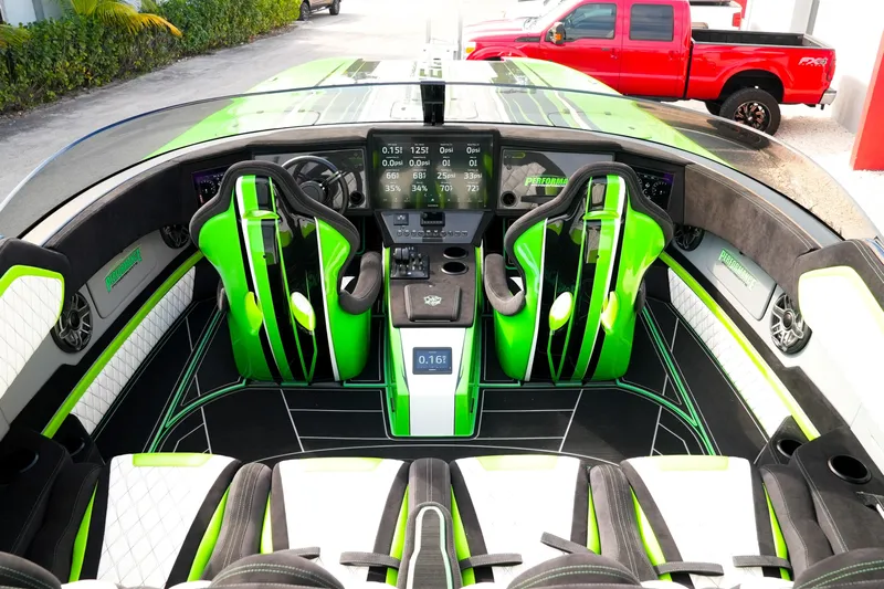  Yacht Photos Pics Interior of 2025 Performance Powerboats P360 with vibrant green accents and advanced dashboard.