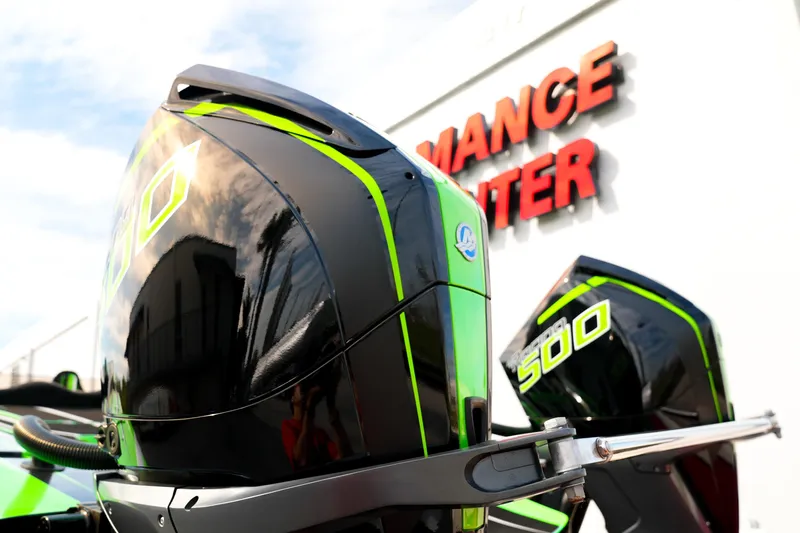  Yacht Photos Pics 2025 Performance Powerboats P360 with vibrant green accents at a performance center.