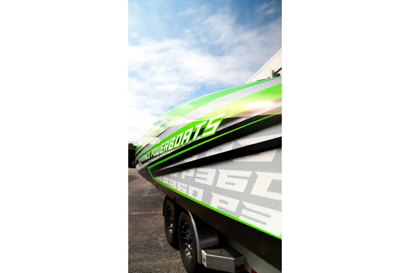  Yacht Photos Pics 2025 Performance Powerboats P360 with vibrant green and white design on a trailer.
