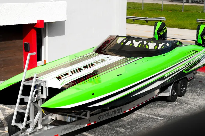  Yacht Photos Pics 2025 Performance Powerboats P360 in vibrant green on a trailer, showcasing sleek design.