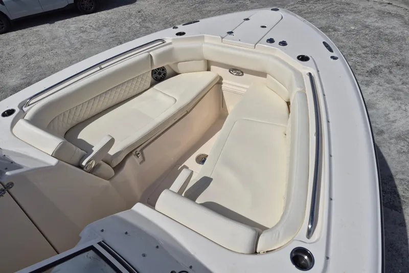 307-628 Yacht Photos Pics 2026 Grady-White Freedom 307 boat interior with white cushioned seating.