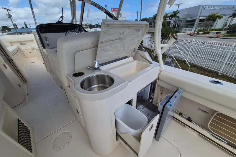 307-628 Yacht Photos Pics 2026 Grady-White Freedom 307 boat interior with sink and storage compartments.
