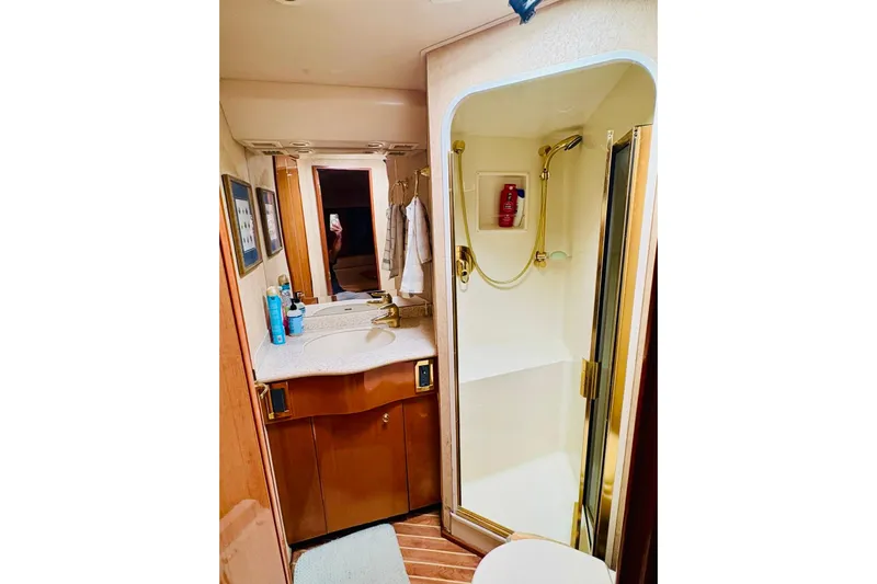  Yacht Photos Pics Bathroom interior of 2004 Viking 45 Convertible yacht with shower and vanity.