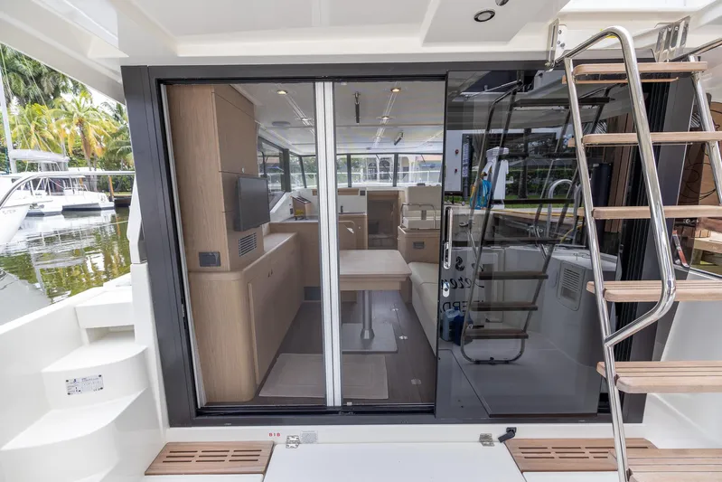 Unfiltered Yacht Photos Pics 2023 Beneteau Swift Trawler 35 interior view with modern design and wooden accents.