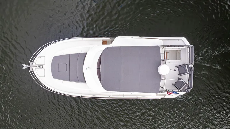Unfiltered Yacht Photos Pics Aerial view of 2023 Beneteau Swift Trawler 35 on water.