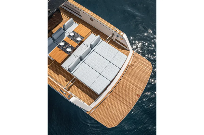  Yacht Photos Pics 2023 Pardo Yachts P43 deck with elegant seating and dining area on water.