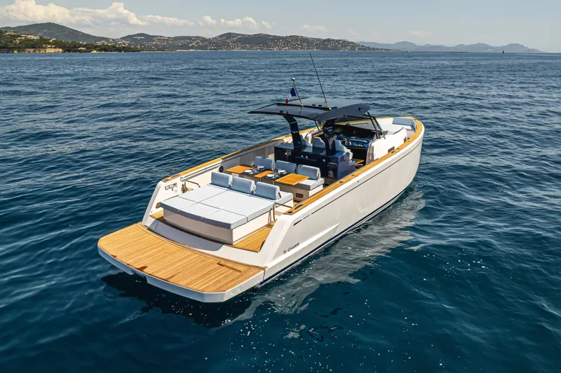  Yacht Photos Pics 2023 Pardo Yachts P43 cruising on open sea with scenic coastal backdrop.