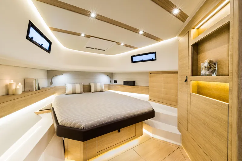 Yacht Photos Pics Luxurious interior of 2023 Pardo Yachts P43, featuring elegant wood finishes and modern lighting.