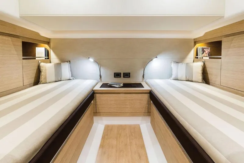  Yacht Photos Pics Luxurious 2023 Pardo Yachts P43 cabin with twin beds and modern lighting.