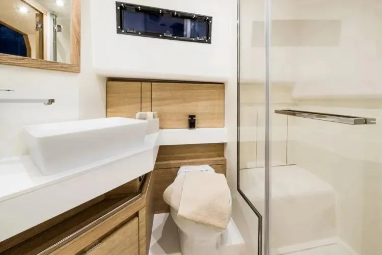  Yacht Photos Pics Luxurious bathroom interior of 2023 Pardo Yachts P43, featuring modern fixtures and elegant wood accents.