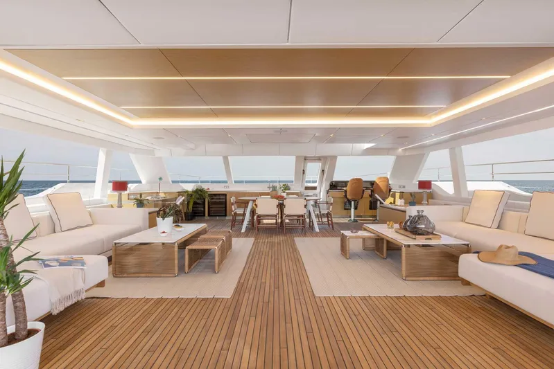  Yacht Photos Pics Luxurious interior of 2026 Sunreef 80 Sunreef Power yacht with elegant seating and wooden flooring.