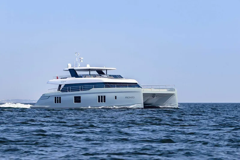  Yacht Photos Pics Luxury 2026 Sunreef 80 Power yacht cruising on open sea.