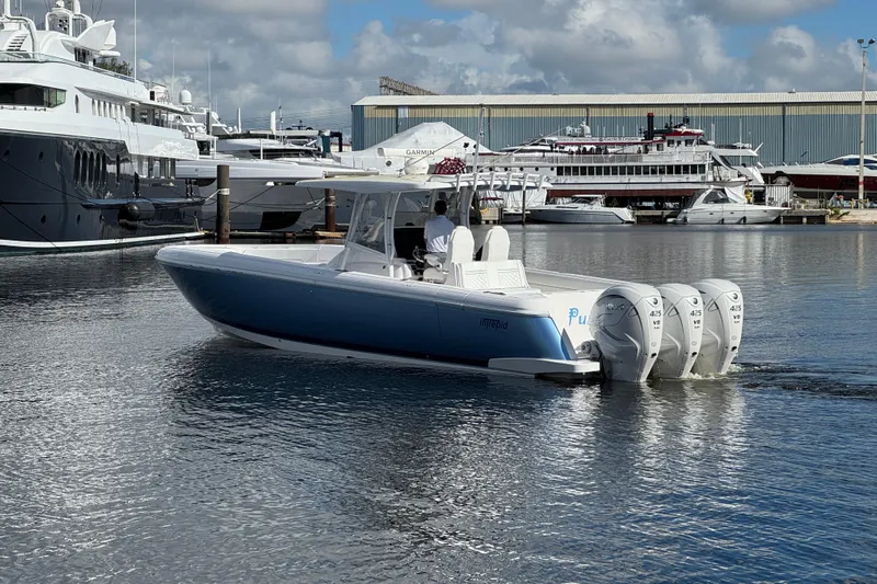  Yacht Photos Pics 2020 Intrepid 407 Nomad FE boat with four engines docked in a marina.