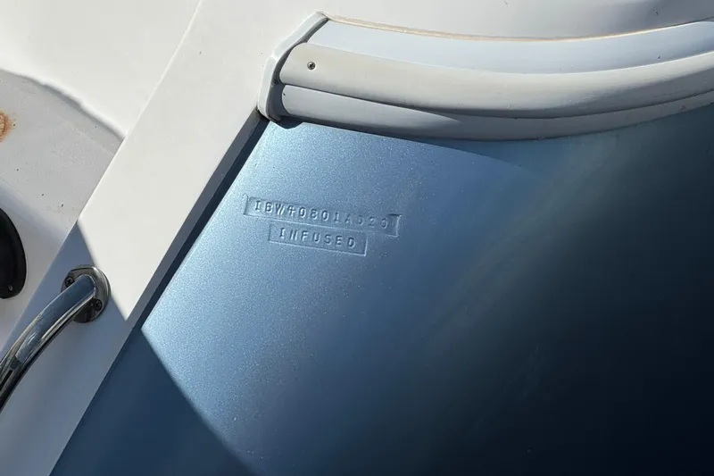 Yacht Photos Pics Close-up of 2020 Intrepid 407 Nomad FE boat hull with embossed text.