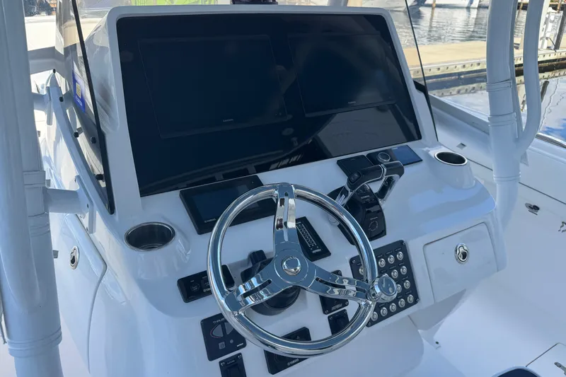  Yacht Photos Pics 2020 Intrepid 407 Nomad FE boat dashboard with steering wheel and electronic controls.