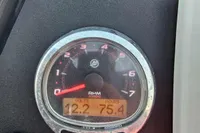 Quicksilver 675 Sundeck 2017 dashboard showing RPM gauge and digital display.