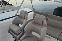 2017 Quicksilver 675 Sundeck boat interior with dual seats at marina.