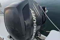 2017 Quicksilver 675 Sundeck with Mercury outboard engine at marina.