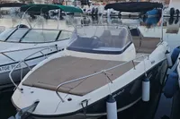 2017 Quicksilver 675 Sundeck boat docked in a marina at sunset.