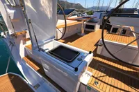 2022 Hanse 460 yacht deck with modern steering and outdoor grill.
