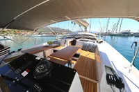 Luxury Hanse 460 yacht deck, 2022 model, with elegant seating and navigation equipment.
