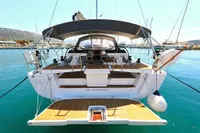 2022 Hanse 460 yacht docked in a marina, showcasing its spacious deck and modern design.