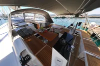 Luxurious 2022 Hanse 460 yacht with spacious deck and elegant seating area.