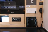 Control panel and appliances in a 2022 Hanse 460 yacht interior.