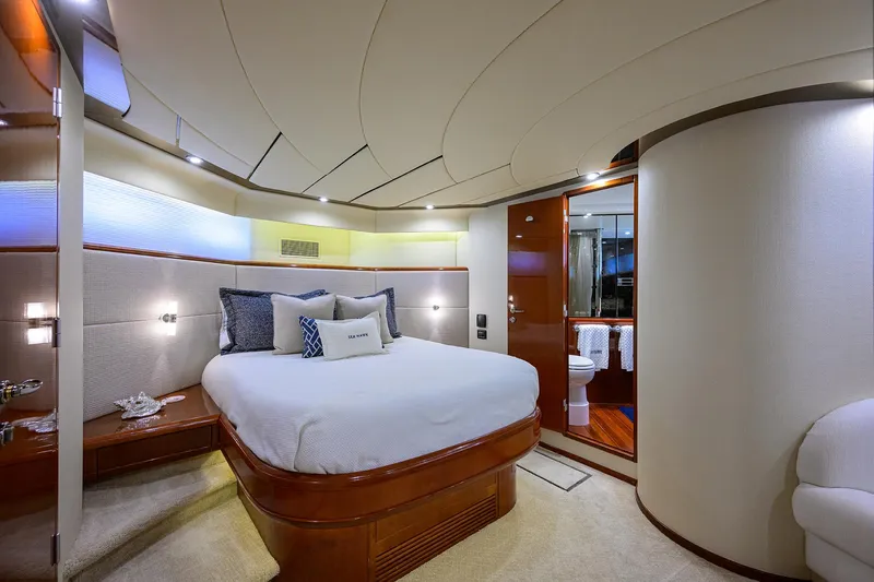 Sea Hawk Yacht Photos Pics Luxurious bedroom interior of a 1997 Fairline Squadron yacht with modern design.