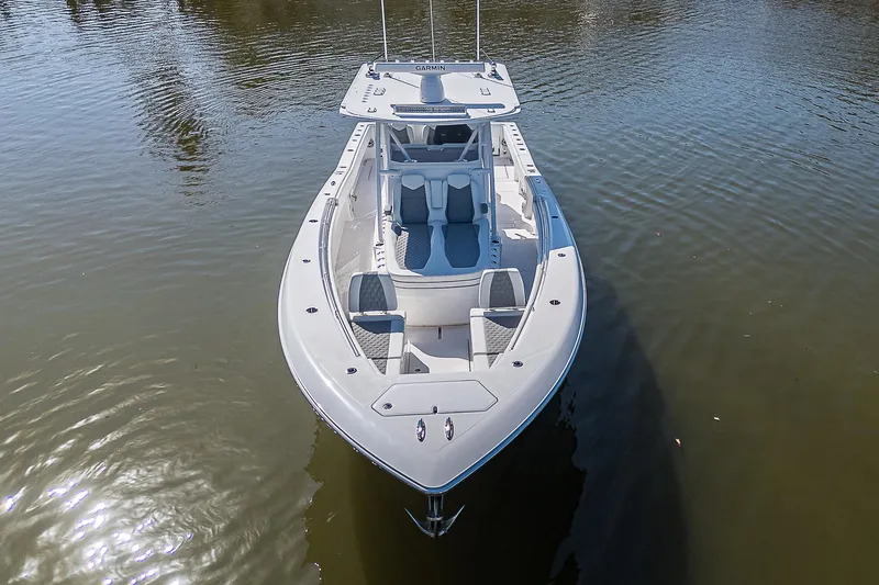  Yacht Photos Pics 2024 Invincible 39 Open Fisherman boat on calm water, aerial view.