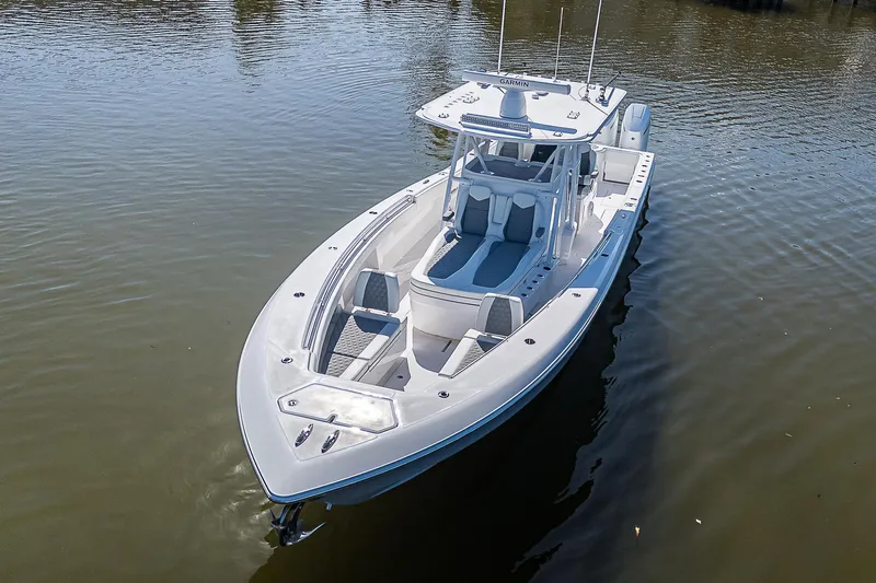  Yacht Photos Pics 2024 Invincible 39 Open Fisherman boat on calm water, aerial view.